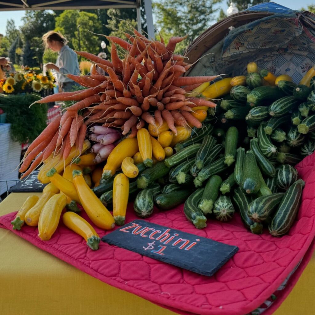 Photo of Carrots and Zucchini at for sale at the Farmers Market.